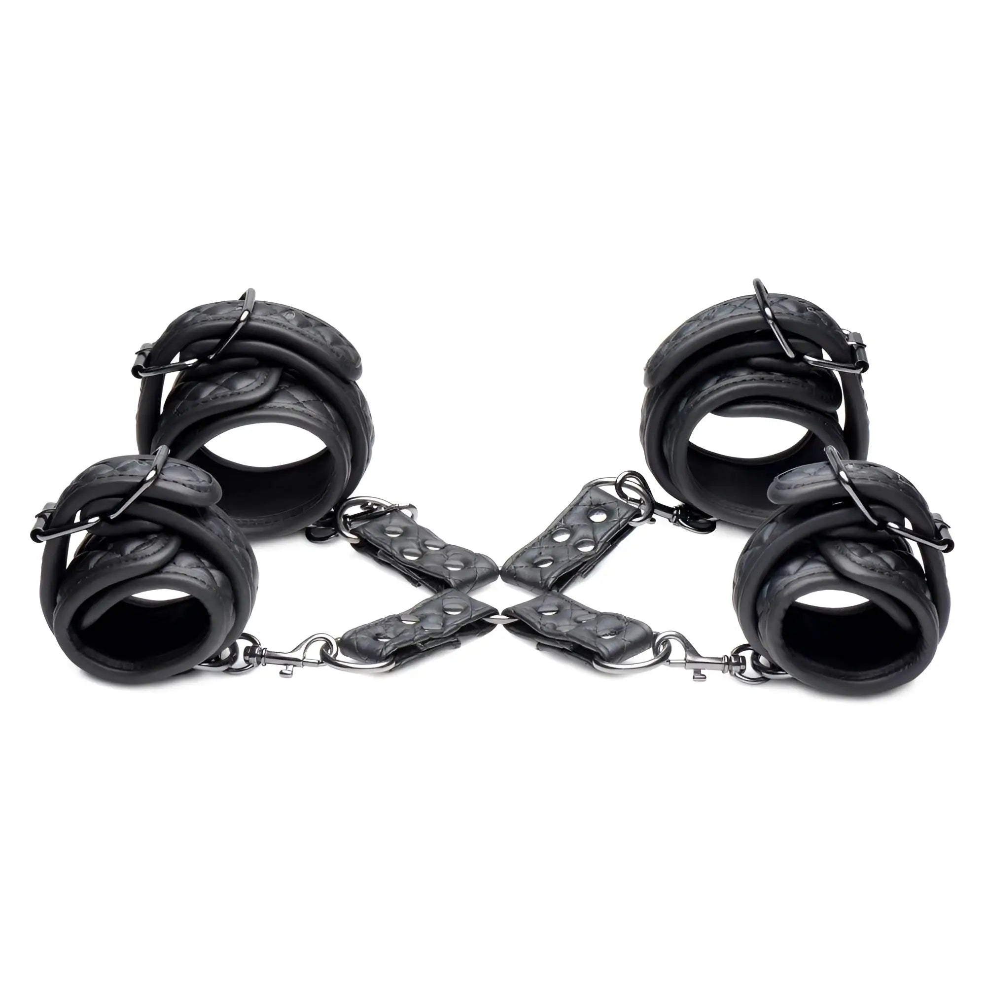 Master Series Concede black quilted leather wrist and ankle restraints with metal hardware and hog-tie adaptor.