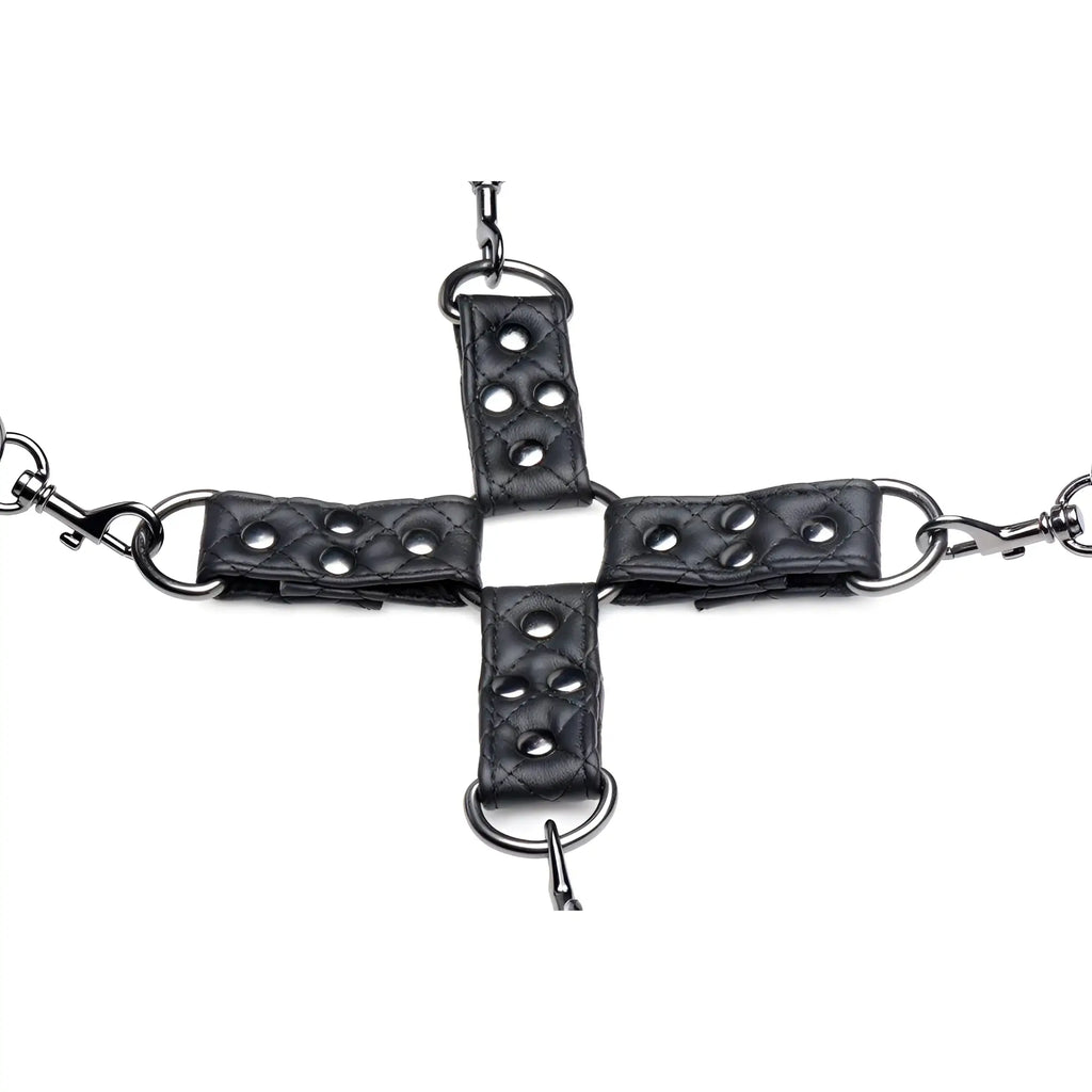Master Series Concede restraint set: four black quilted leather straps connected by silver hardware in a cross shape.