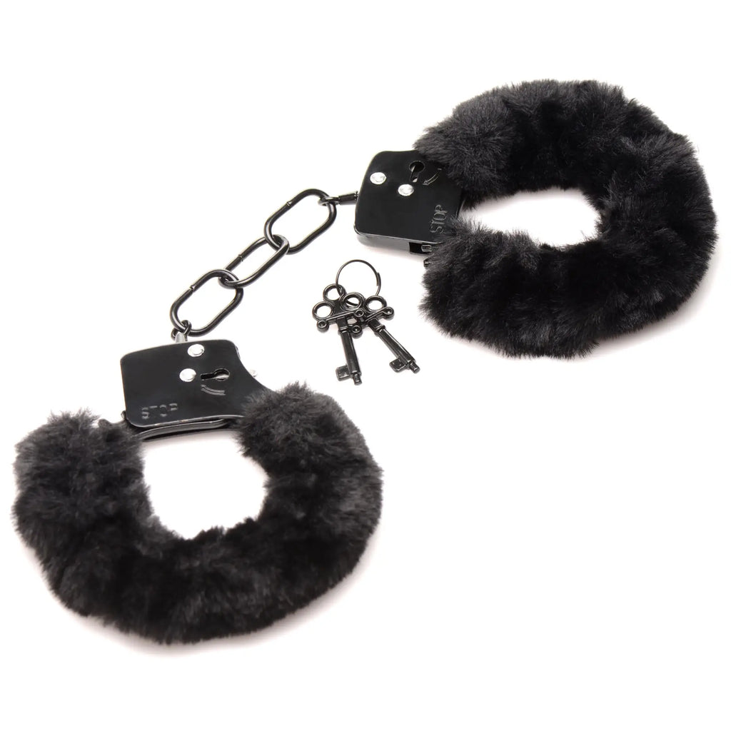 Master Series Cuffed In Fur: Black metal handcuffs lined with soft black faux fur, shown with a matching key set.
