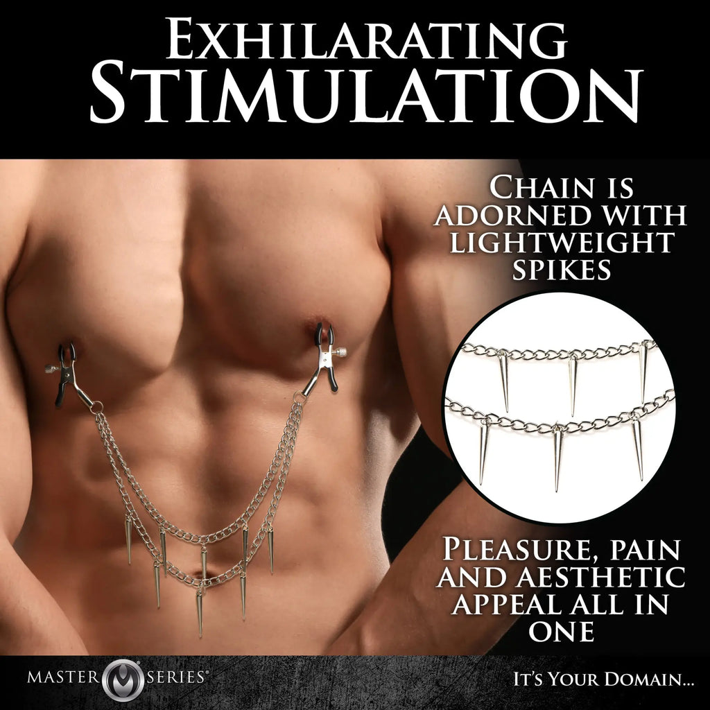 Master Series Dagger nipple clamps featuring silver double chains and dangling spike charms worn on a male torso.