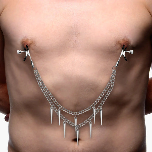 Master Series Daggers: Silver-tone nipple clamps with two connecting chains and dangling spike charms on a person.