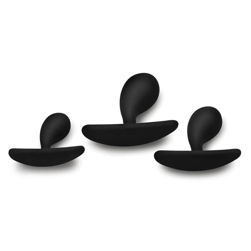 Master Series Dark Droplets: three matte black, curved, silicone anal trainers in varying sizes against a white background.