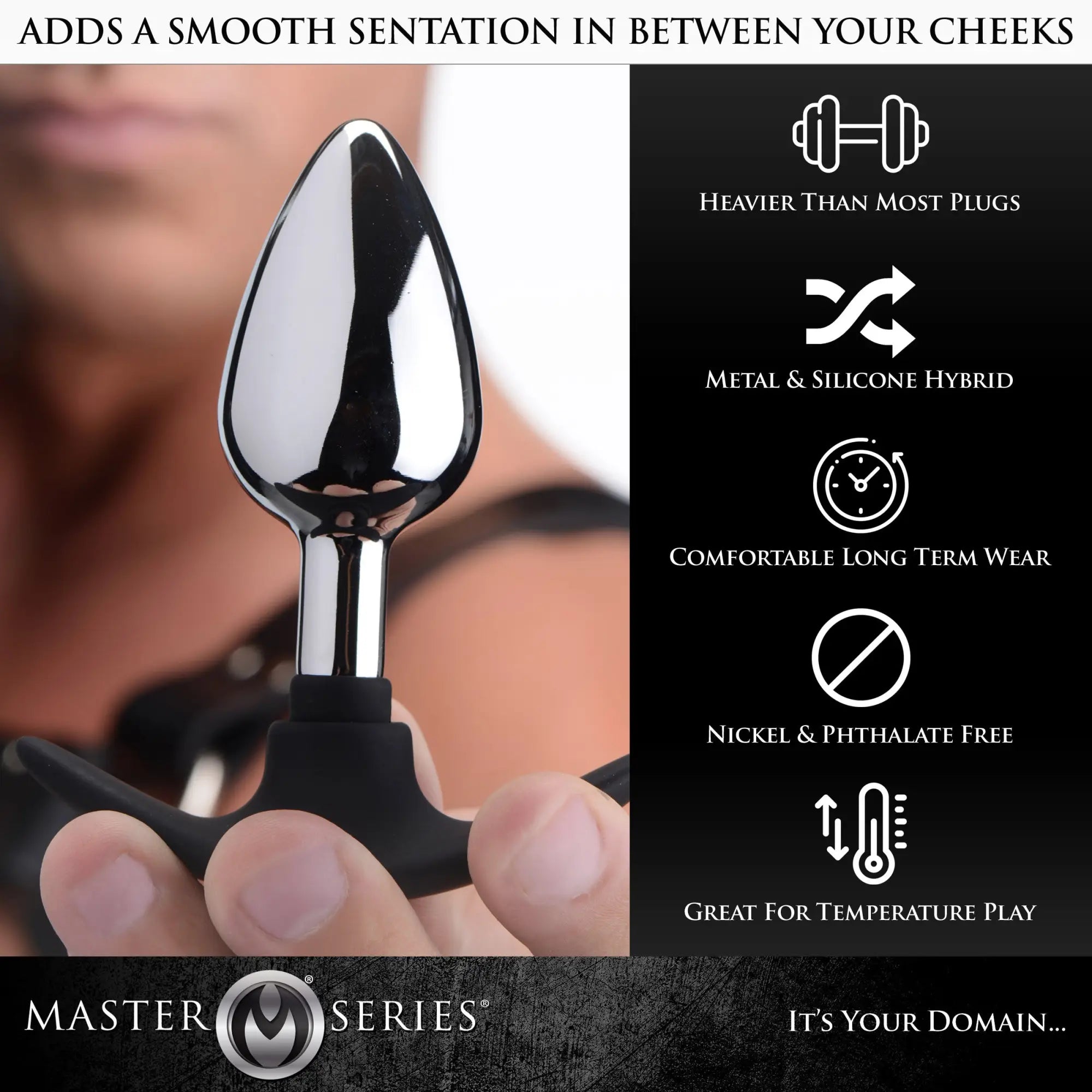 Master Series Dark Invader anal plug with a polished silver metal tip and black silicone base held in a hand.