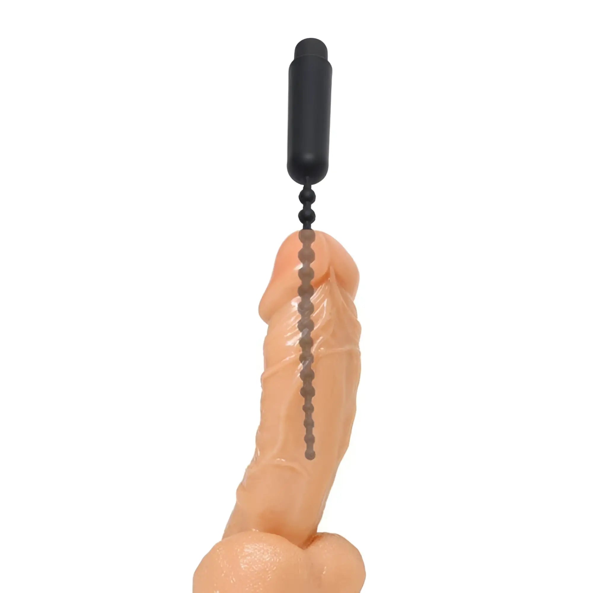 Master Series Dark Rod vibrating beaded silicone sound inserted into a realistic flesh-toned penis model on white background.