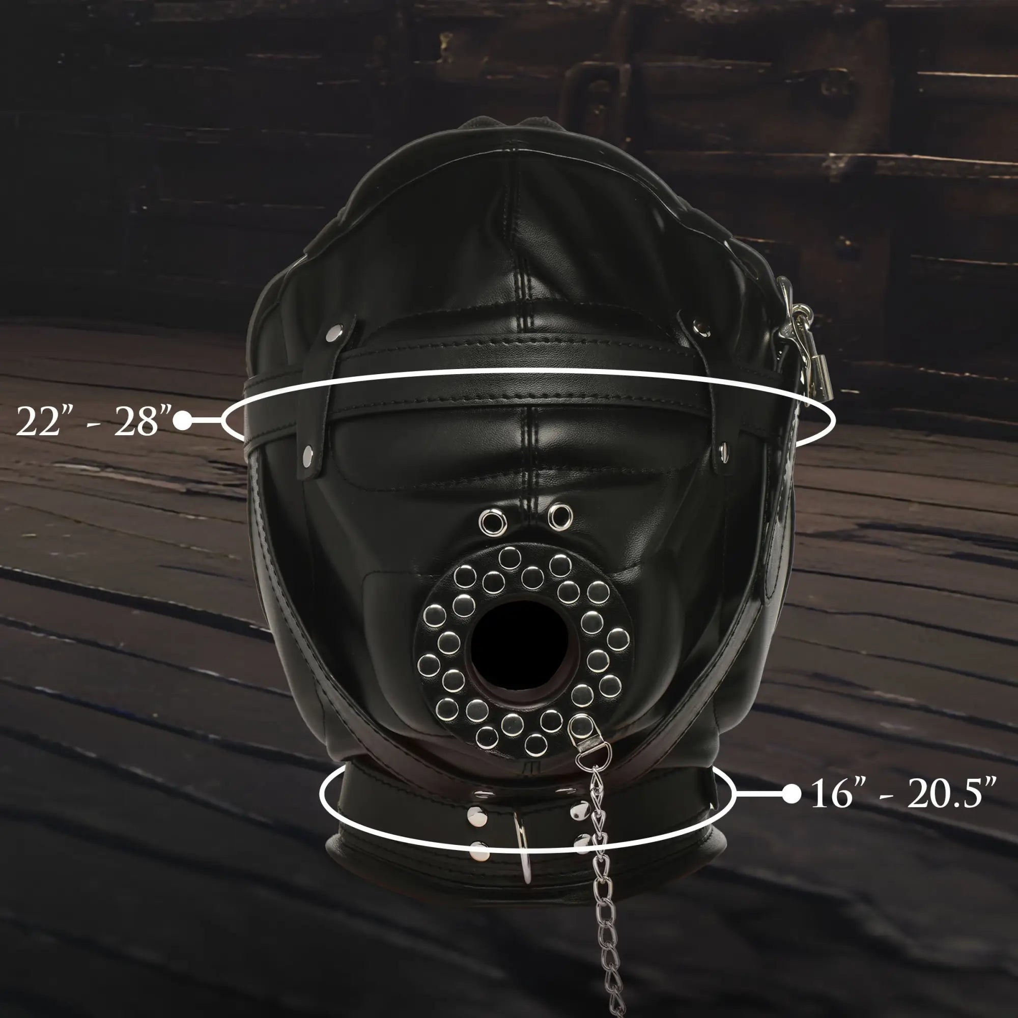 Master Series black faux leather sensory deprivation hood with a silver-studded mouth funnel and adjustable straps.