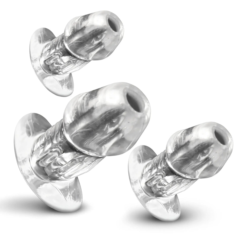 Master Series 3pc set of clear, hollow, phallic-shaped anal plugs with flared bases, shown in varying sizes.