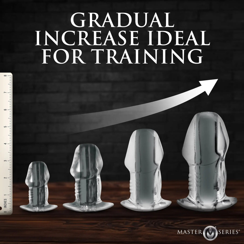 Master Series Clear Hollow Anal Plugs in four ascending sizes, showing height increase on a dark background.