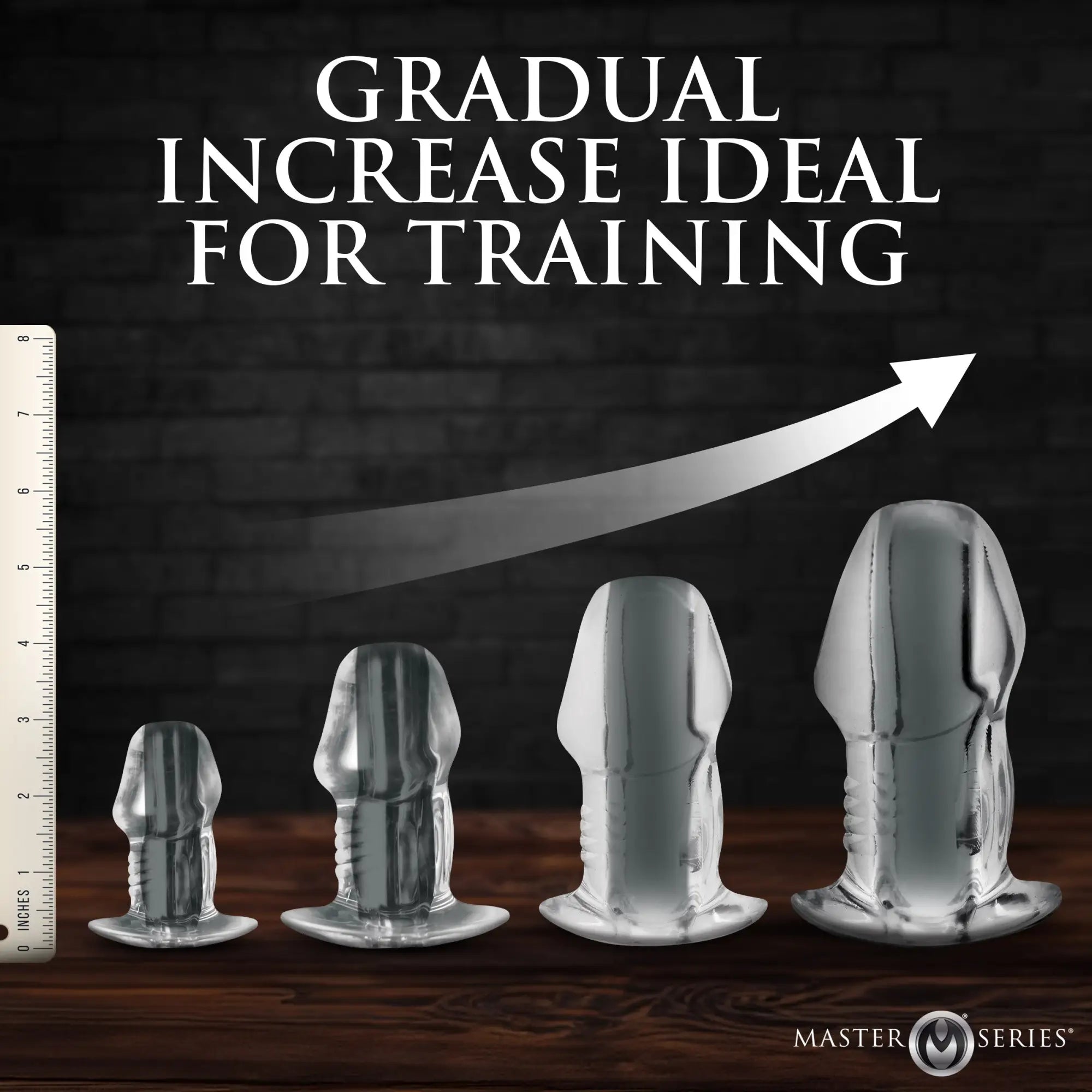 Master Series Clear Hollow Anal Plugs in four ascending sizes, showing height increase on a dark background.