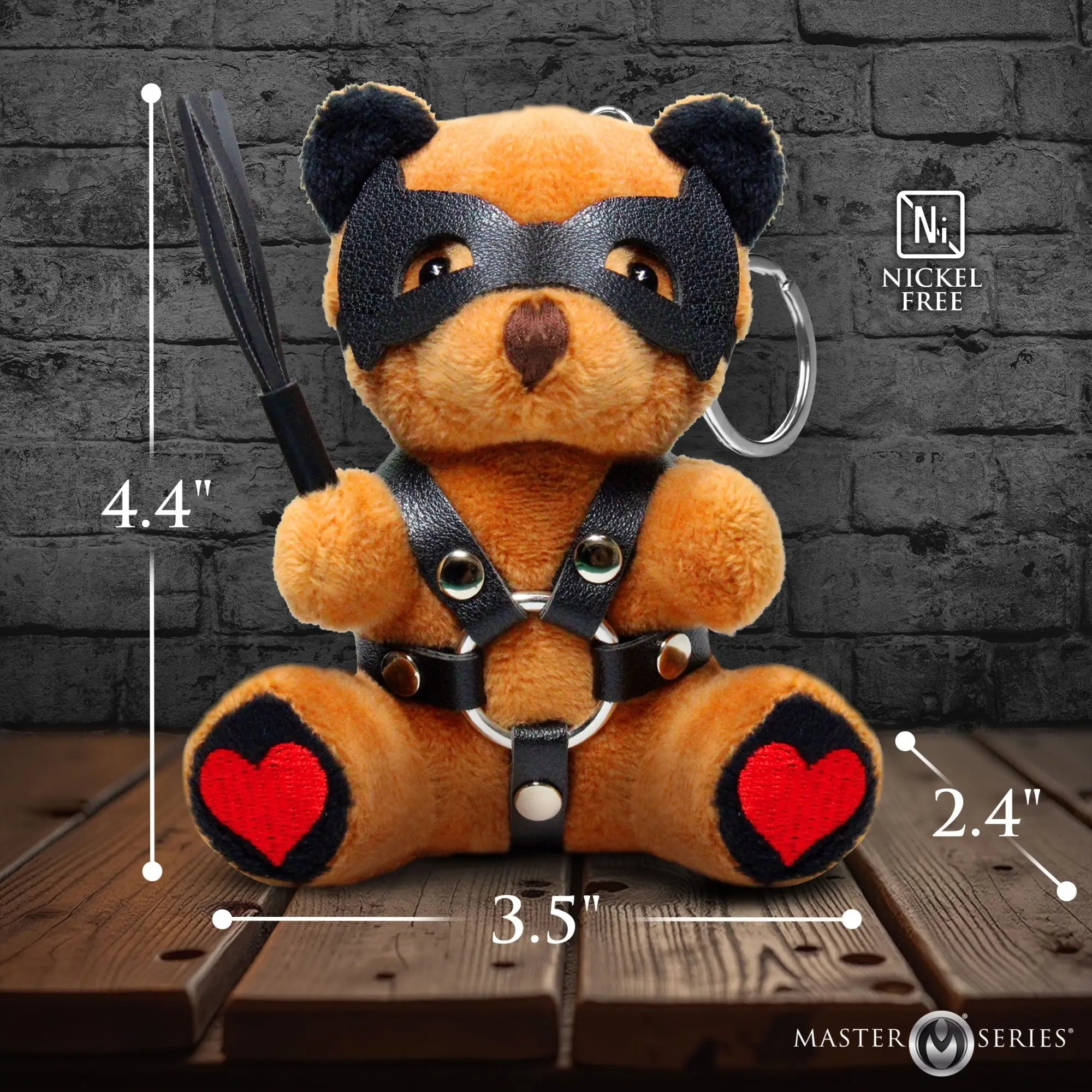Master Series Dom Bear keychain: brown plush teddy wearing a black faux-leather mask, harness, and holding a whip.