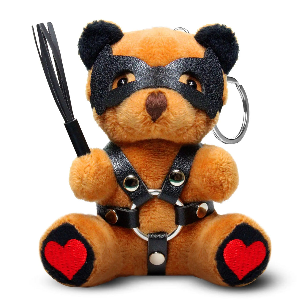 Master Series Dom Bear keychain: brown plush bear in a leather mask and harness, holding a whip, with red heart pads.