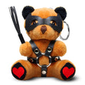 Master Series Dom Bear keychain: brown plush bear in a leather mask and harness, holding a whip, with red heart pads.