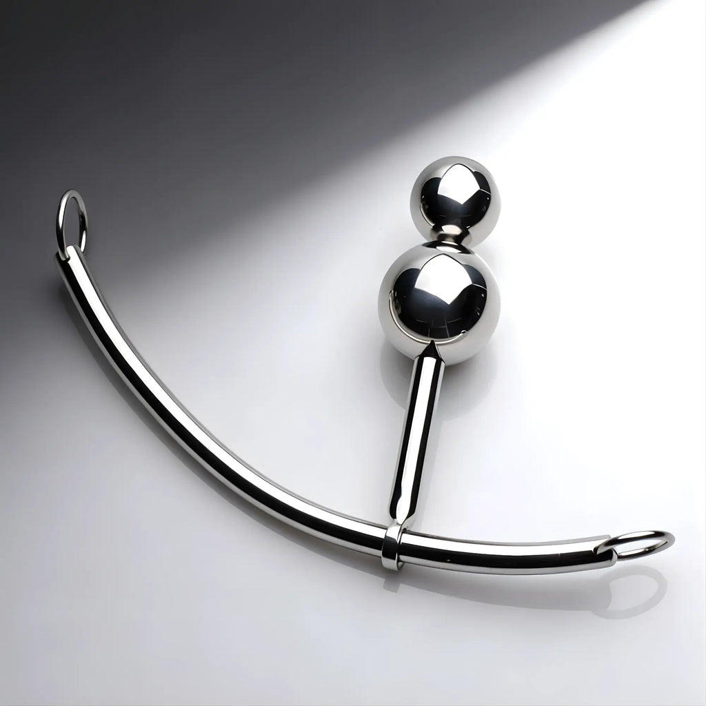 Master Series Double Ball Plug with a reflective silver finish, featuring two spheres attached to a curved sliding rod.