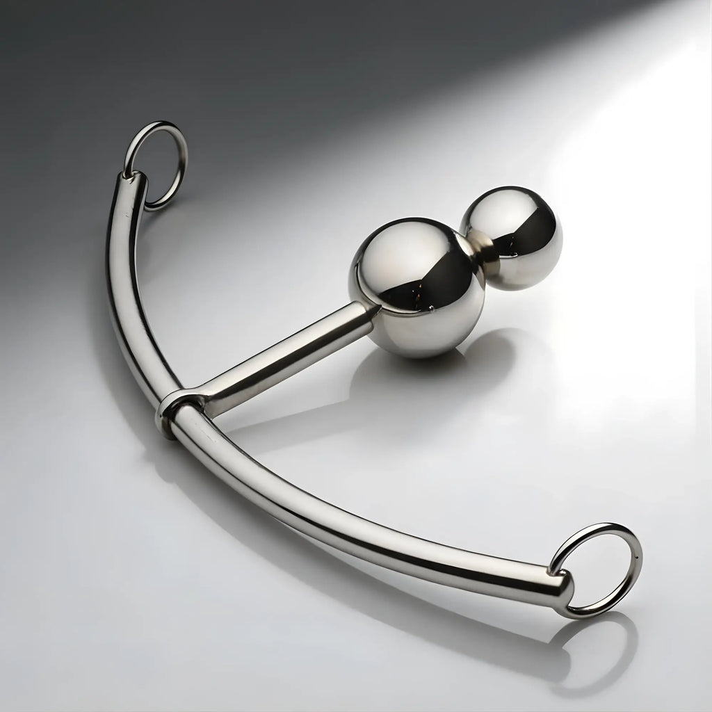Master Series Double Ball Plug with a silver curved rod and sliding rings, featuring a polished stainless steel finish.