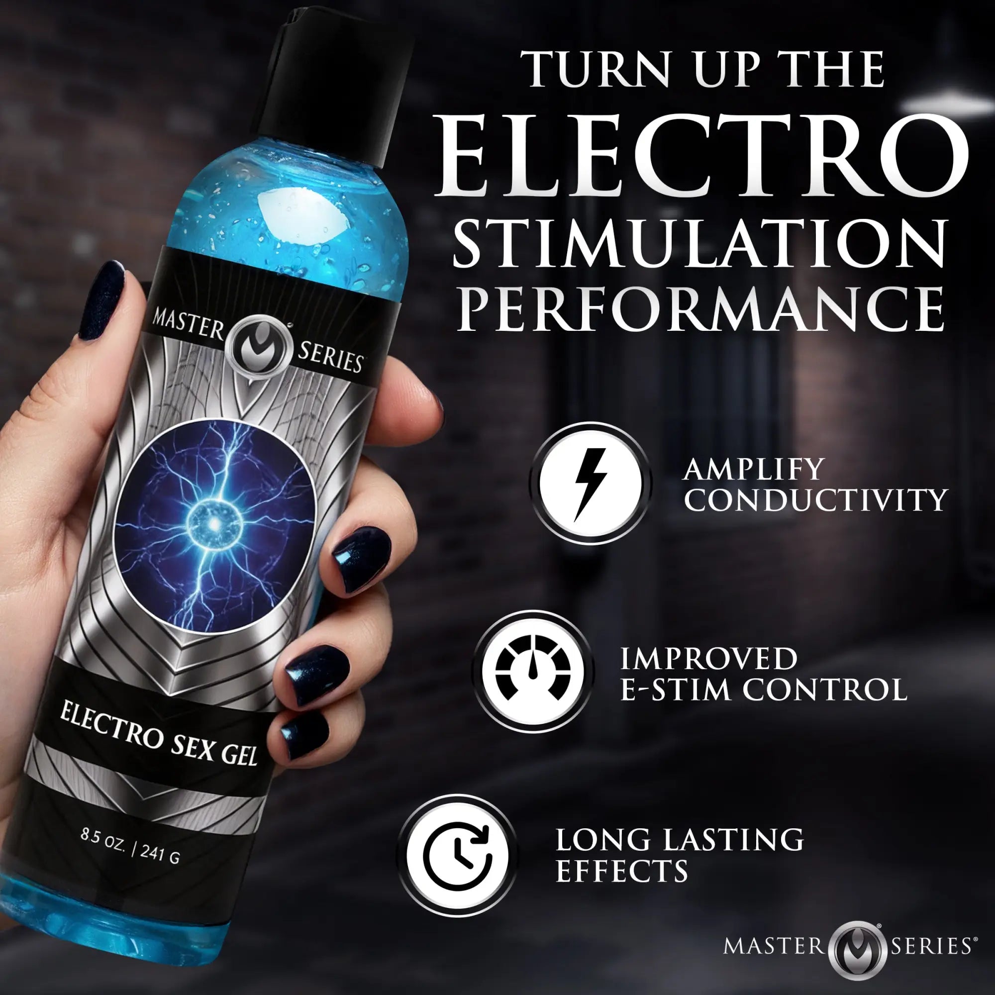 Hand holding 8.5oz bottle of blue Master Series Electro Sex Gel with silver lightning graphic on a black label.