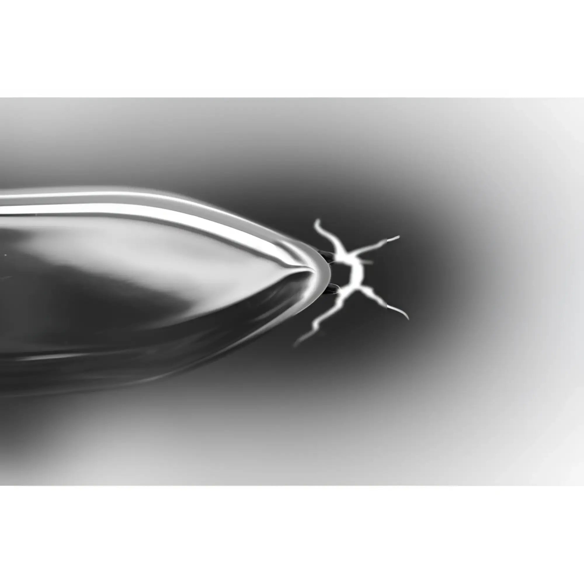Master Series Electro Shank blade with a metallic finish, emitting a bright white electrical spark from its tip.