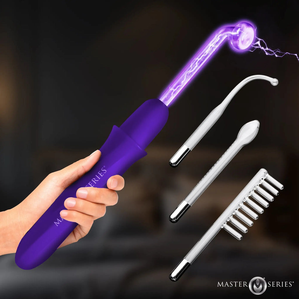 Master Series Elektrawand: Purple rechargeable wand emitting purple electric sparks, shown with three glass attachments.