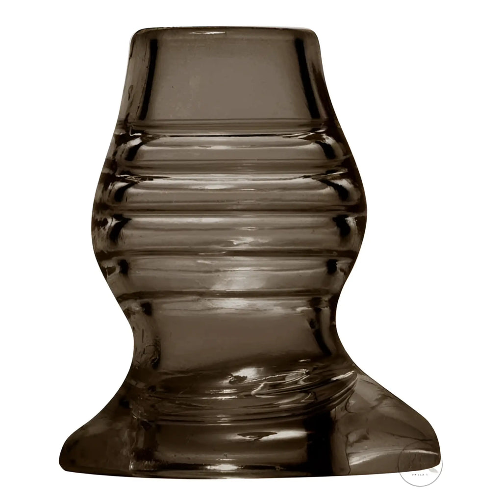 Master Series Excavate Tunnel anal plug: a translucent, smoke-colored, ribbed silicone plug with a wide flared base.