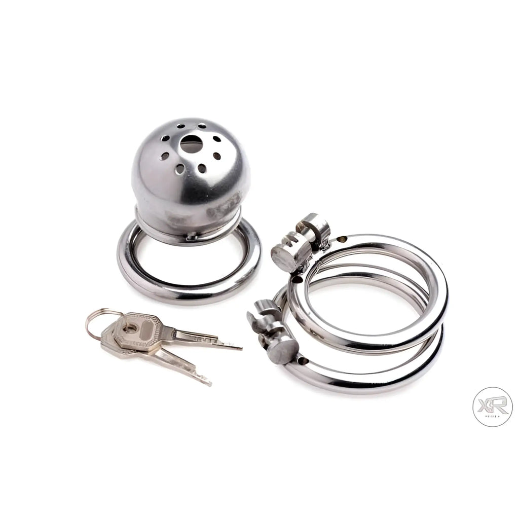 Master Series Exile Deluxe stainless steel confinement cage with ring, spare rings, and two keys on a white background.