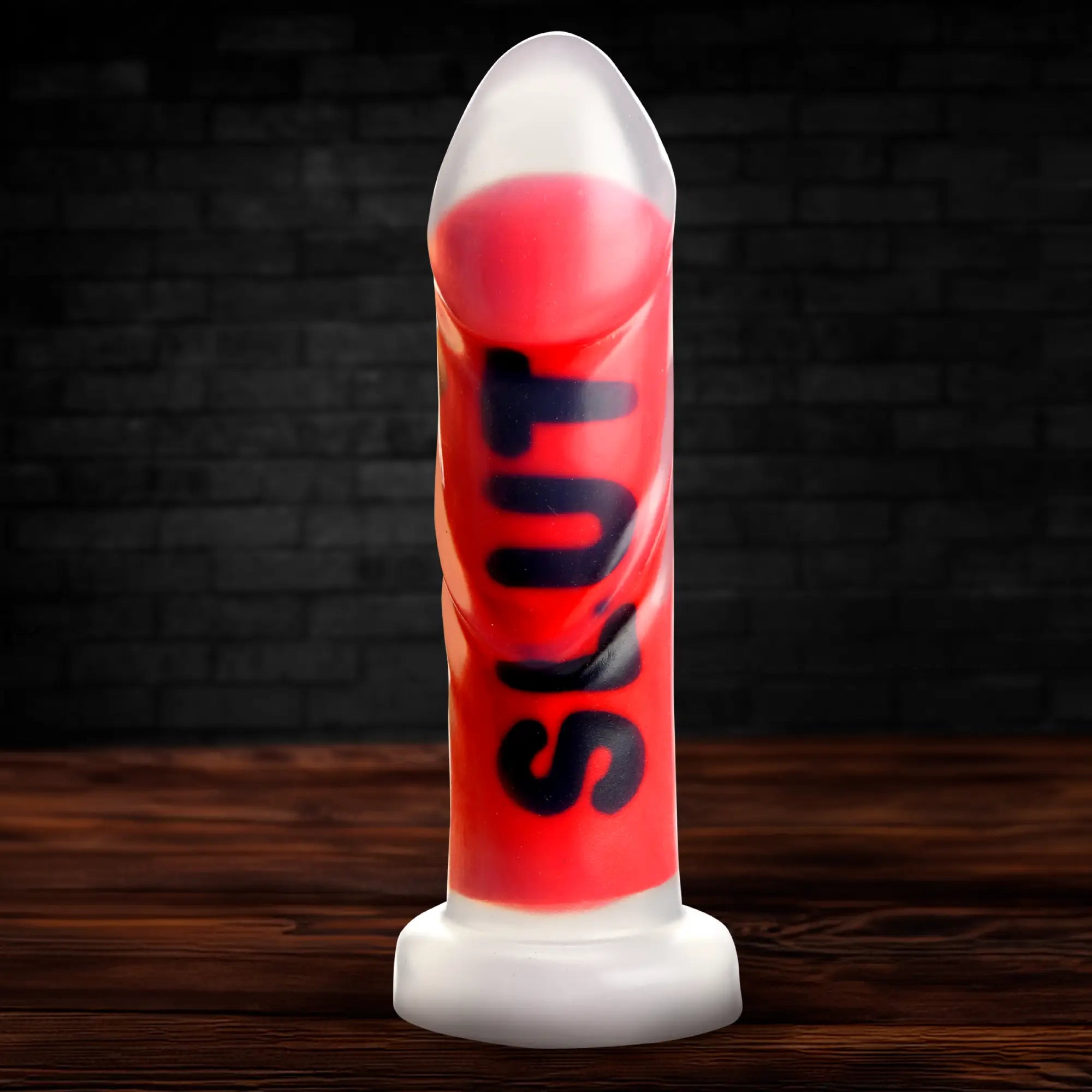 Master Series The Explicit Text dildo, a red silicone shaft with black "SLUT" lettering on a white base.