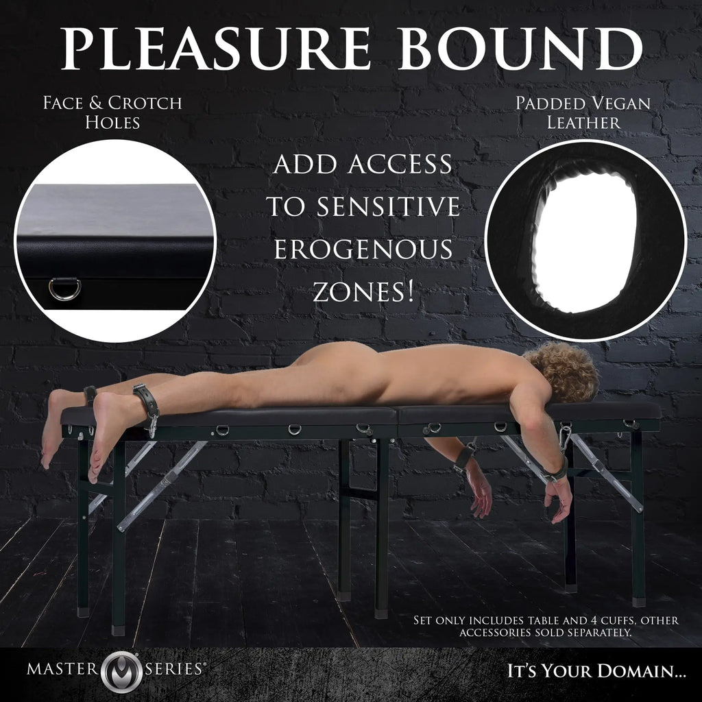 Master Series Extreme Bondage and Milking Table: black vegan leather with cutouts, metal frame, and four cuffs.