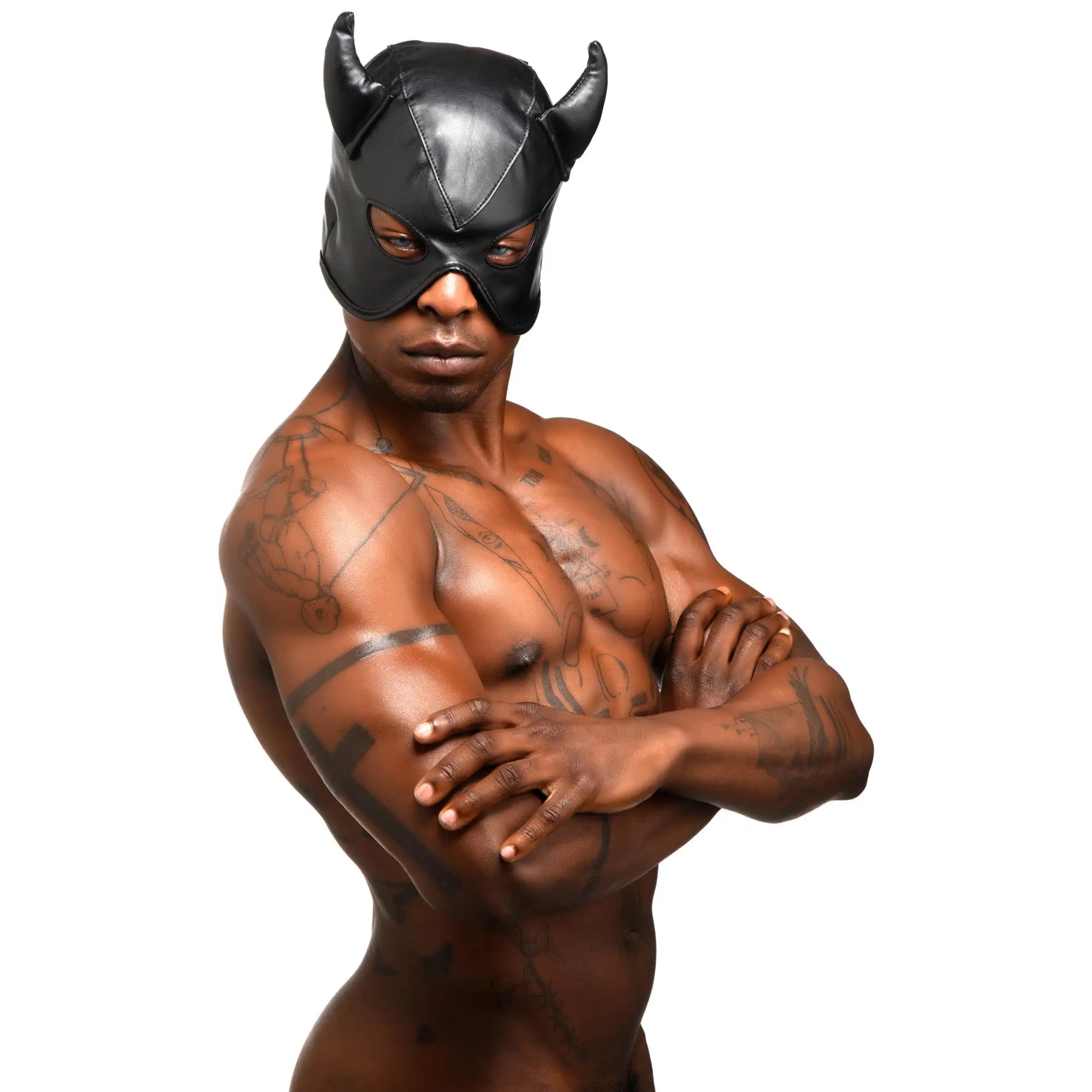 A muscular, tattooed man wears a black faux-leather Master Series Fetish Hood featuring two prominent devil-style horns.