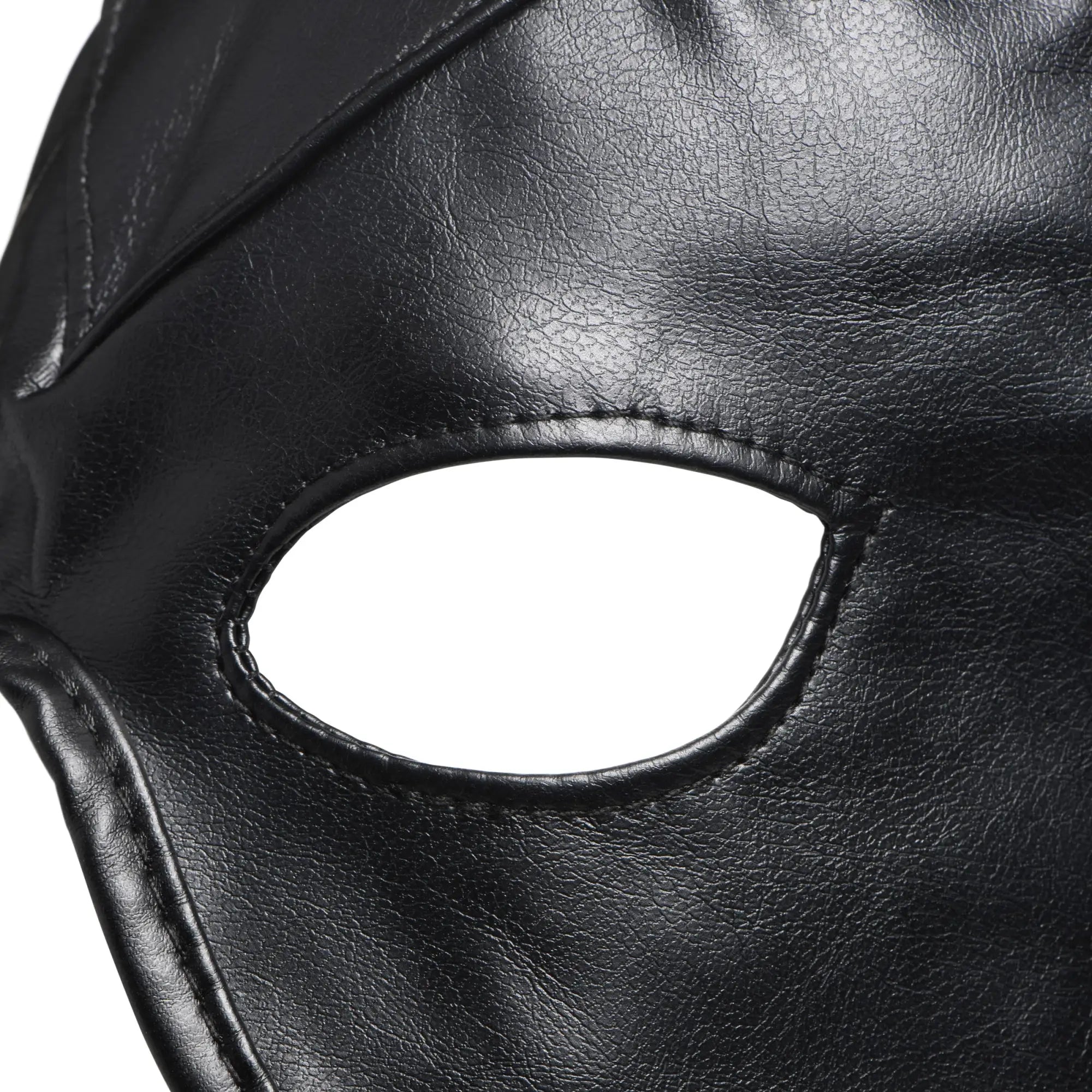 Master Series Fetish Hood with Horns: A close-up of a black, textured leather hood featuring a stitched eye cutout.