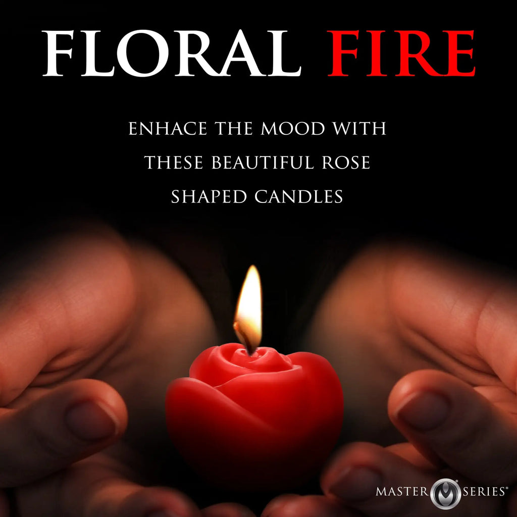Master Series Fire Garden 3pc Rose Candle Set: A red, rose-shaped candle glowing in cupped hands against a black background.