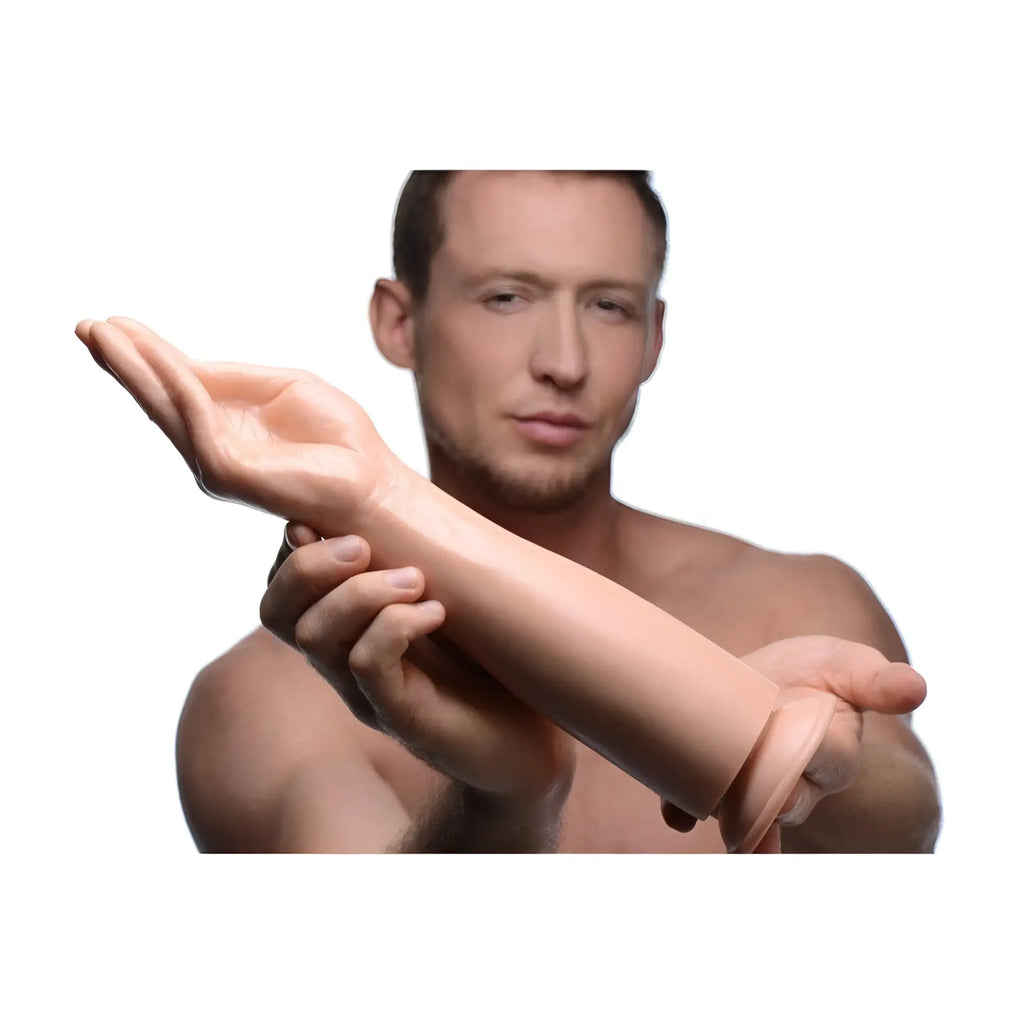 Master Series The Fister hand and forearm dildo: a realistic, skin-toned, molded silicone hand with a flared base.