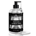 Master Series Fisting Lubricant in a clear pump bottle with a black label, featuring a strand of thick, clear gel.
