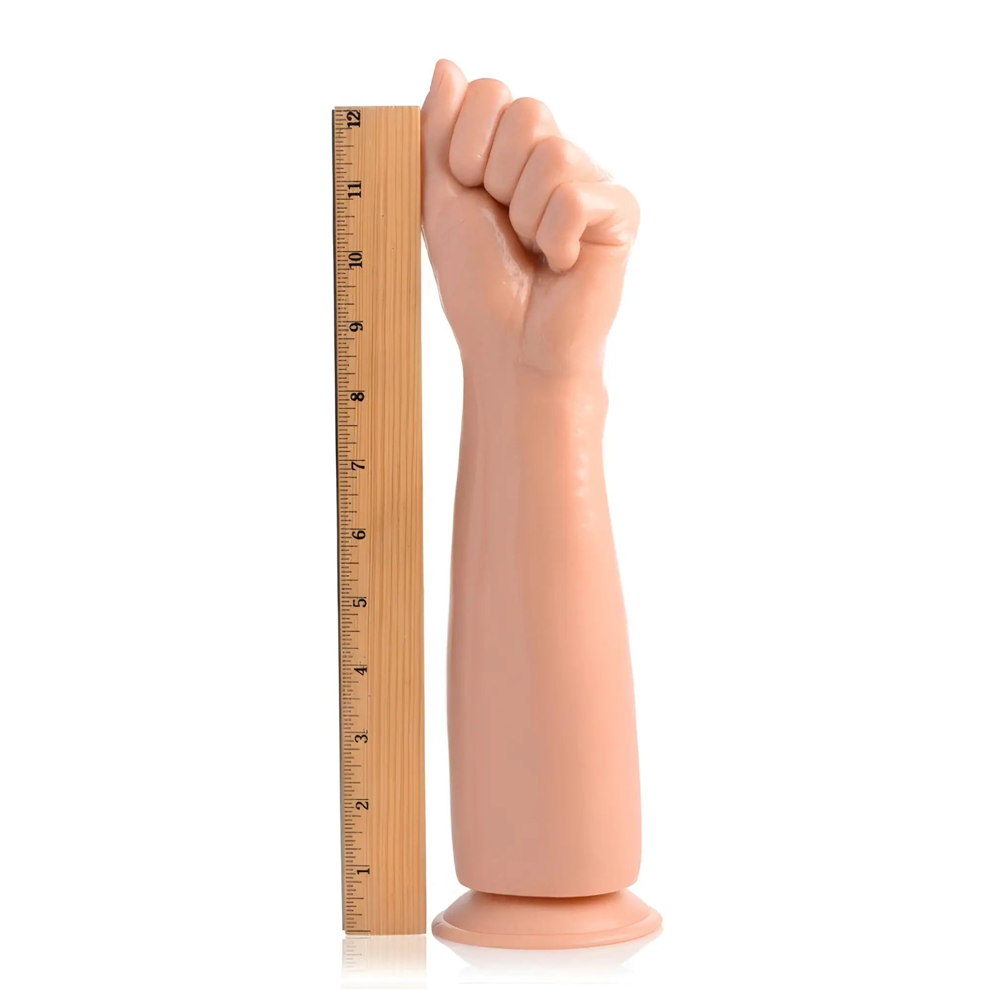 Master Series Fisto clenched fist dildo in light skin tone standing next to a 12-inch ruler for scale on white.