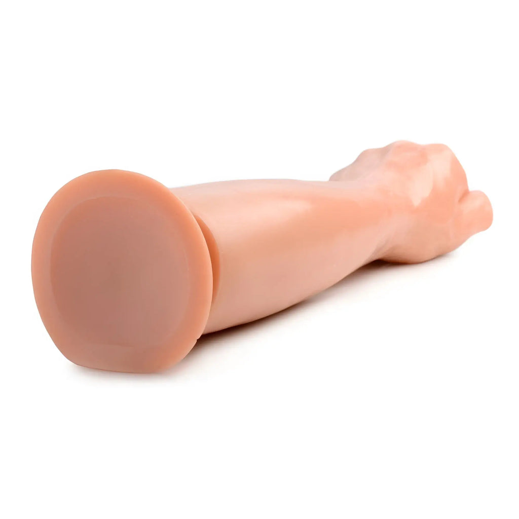Master Series Fisto Clenched Fist dildo in skin-tone with a rounded, flat base for stable placement.