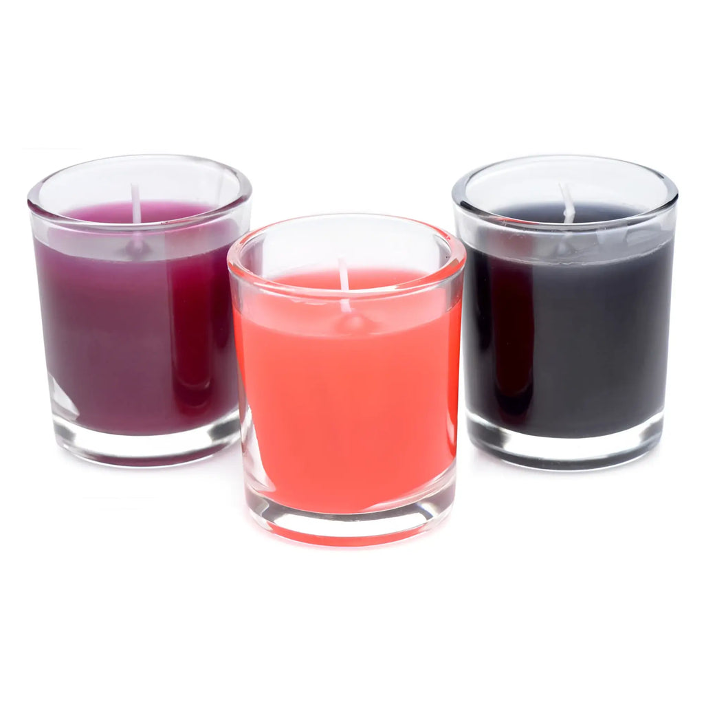 Master Series Flame Drippers wax play candle set: three candles in glass votives with purple, red, and black wax.