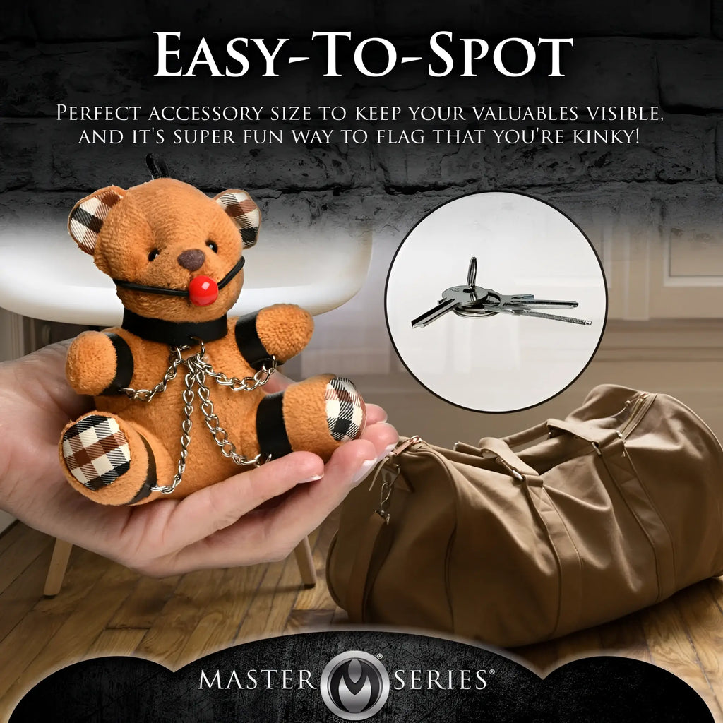 Master Series Gagged Teddy Bear keychain: brown plush bear with red ball gag, black cuffs, and metal chains.