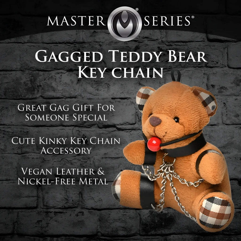 Master Series Gagged Teddy Bear keychain: brown plush bear with plaid accents, black leather gag/harness, and metal chain.
