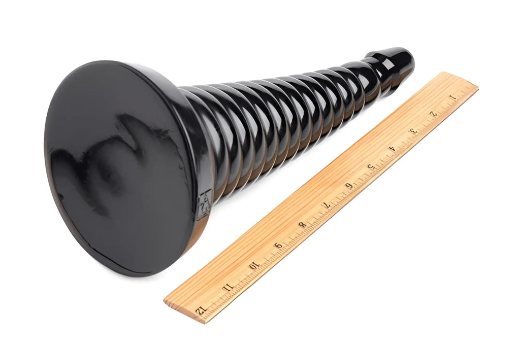 Master Series Giant Ribbed Anal Cone in black next to a wooden ruler for scale on a white background.