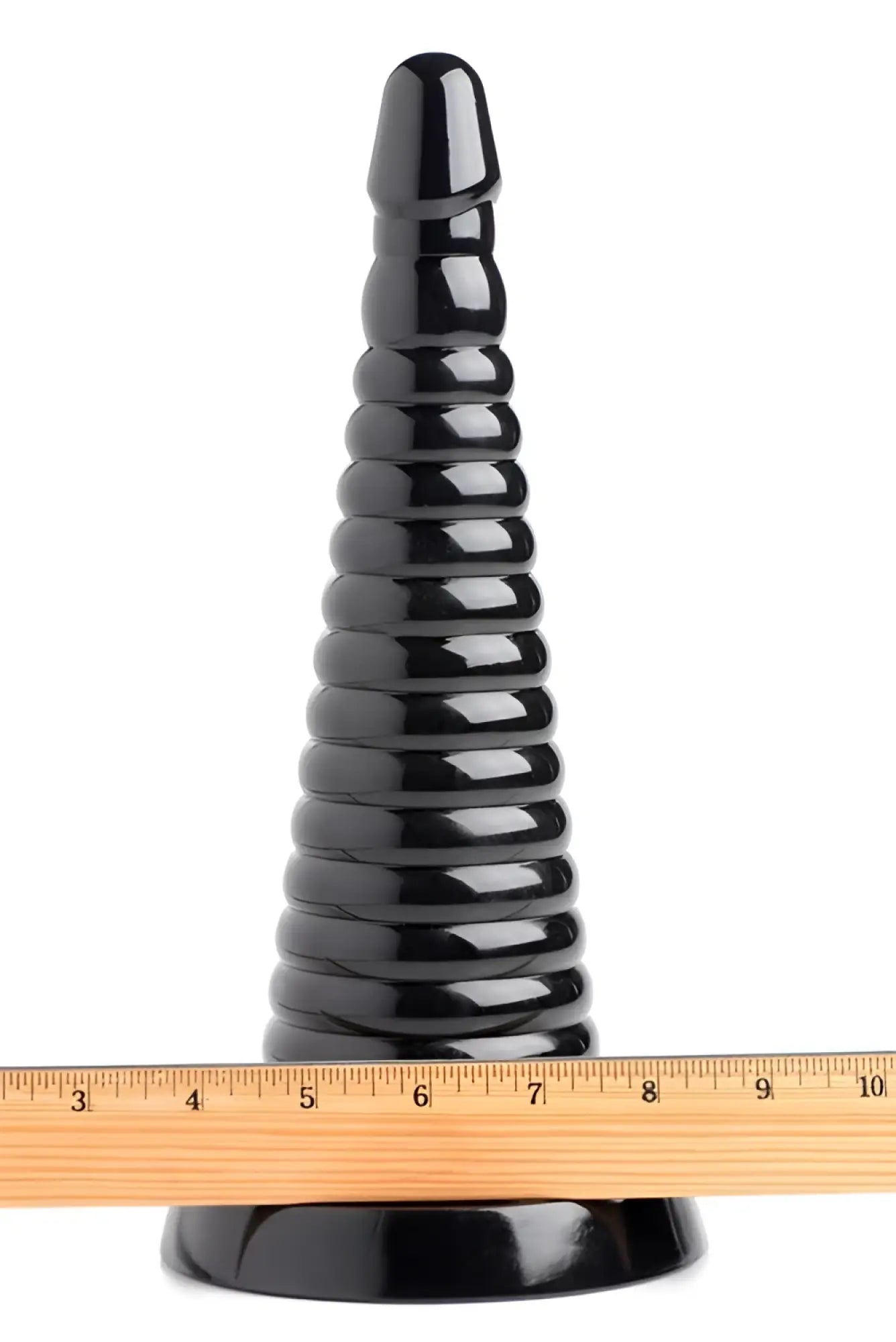 Master Series Giant Ribbed Anal Cone: A tall, glossy black, tapered plug with stacked rings and a wooden ruler for scale.