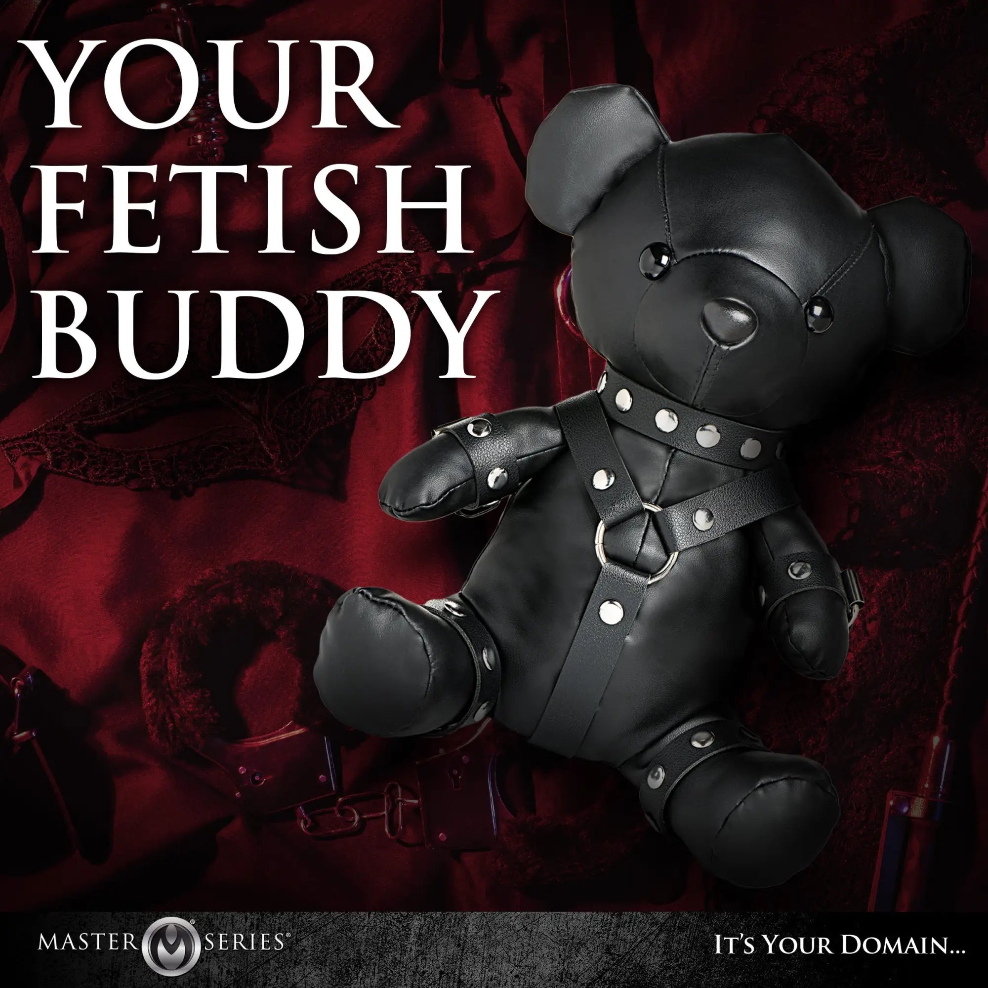 Master Series Gimp Teddy Bear: A black faux-leather bear with a studded harness and collar against a dark red background.