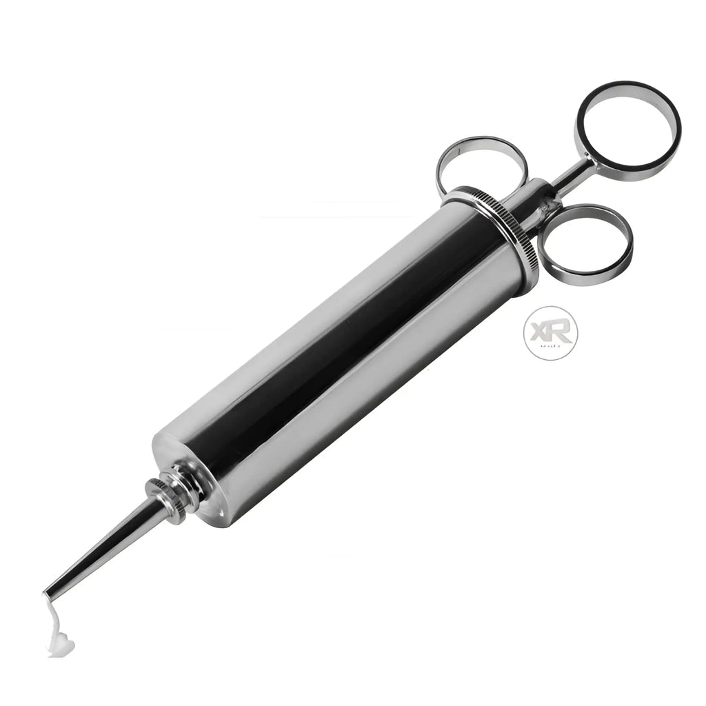 Master Series The Grease Gun, a polished chrome syringe-style applicator with a ring handle, shown on a white background.