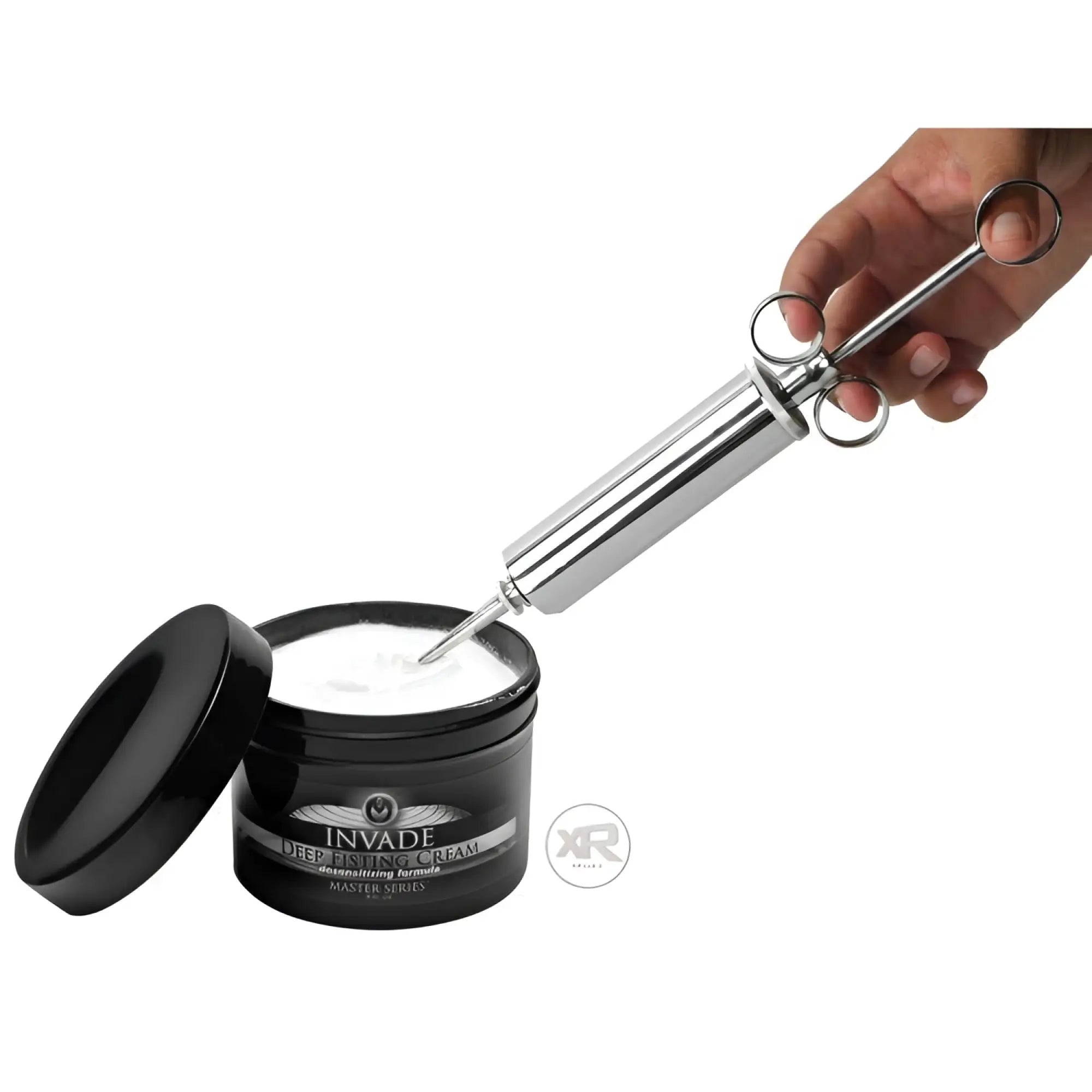 Master Series The Grease Gun: a metal syringe tool scooping white Invade Deep Fisting Cream from a black jar.