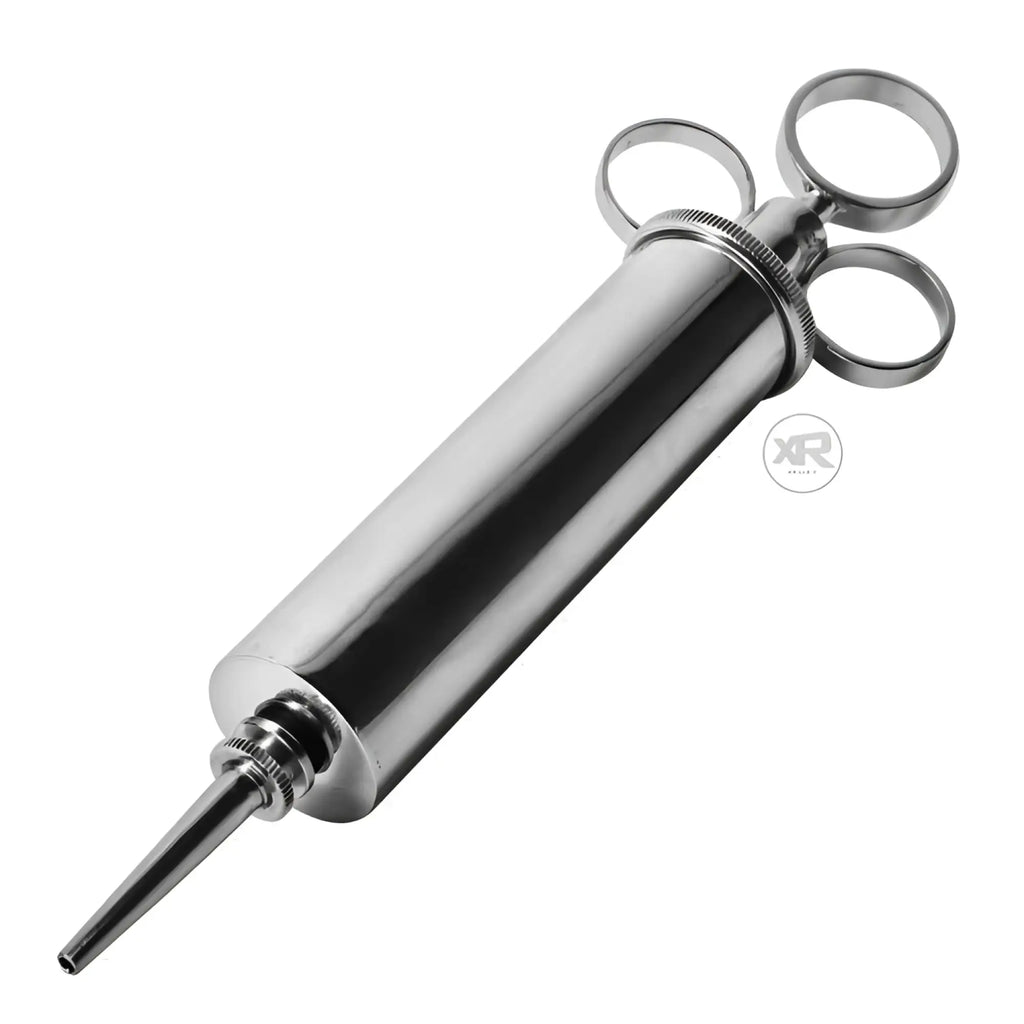 Master Series The Grease Gun: A sleek, silver, syringe-style tool with three circular finger rings.