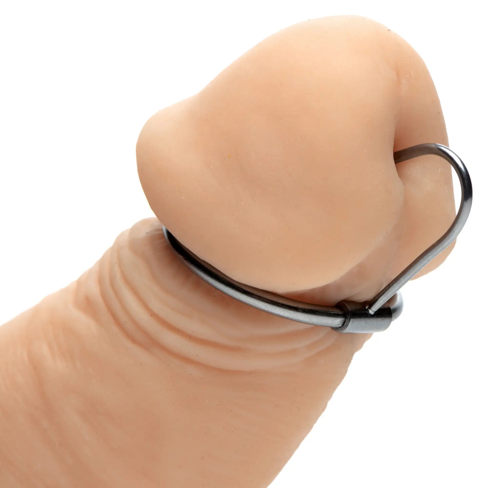 Master Series Halo Urethral Plug with a metallic silver glans ring inserted into a skin-toned phallic model.