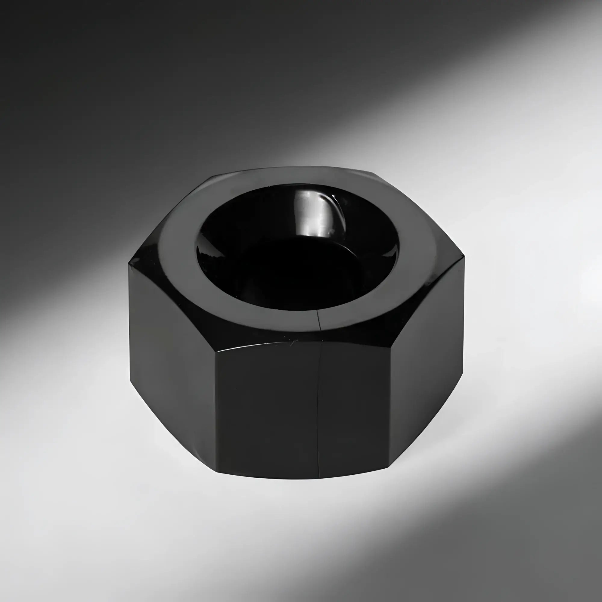 Master Series Hex heavy-duty cock ring and ball stretcher in a glossy black, industrial nut-inspired hexagonal shape.