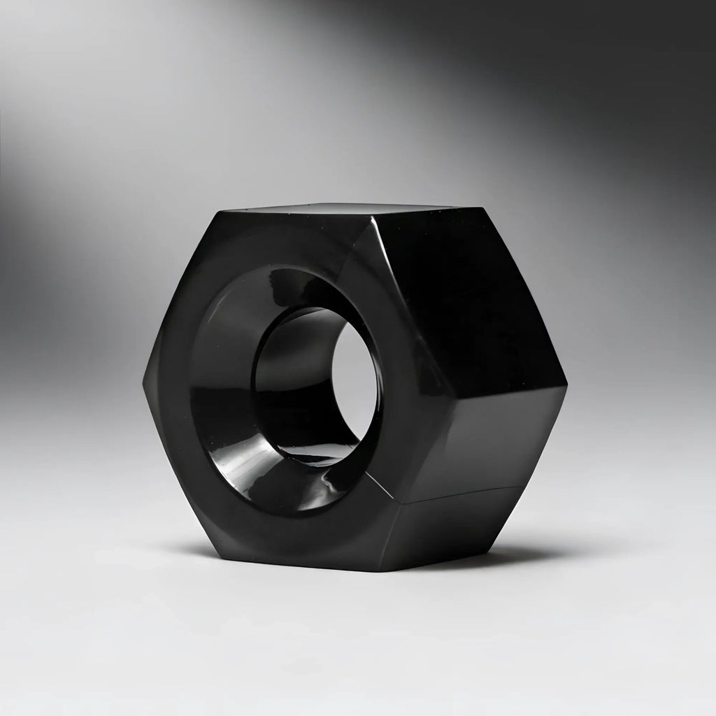 Master Series Hex heavy-duty cock ring and ball stretcher in a glossy, black, hexagonal nut design.