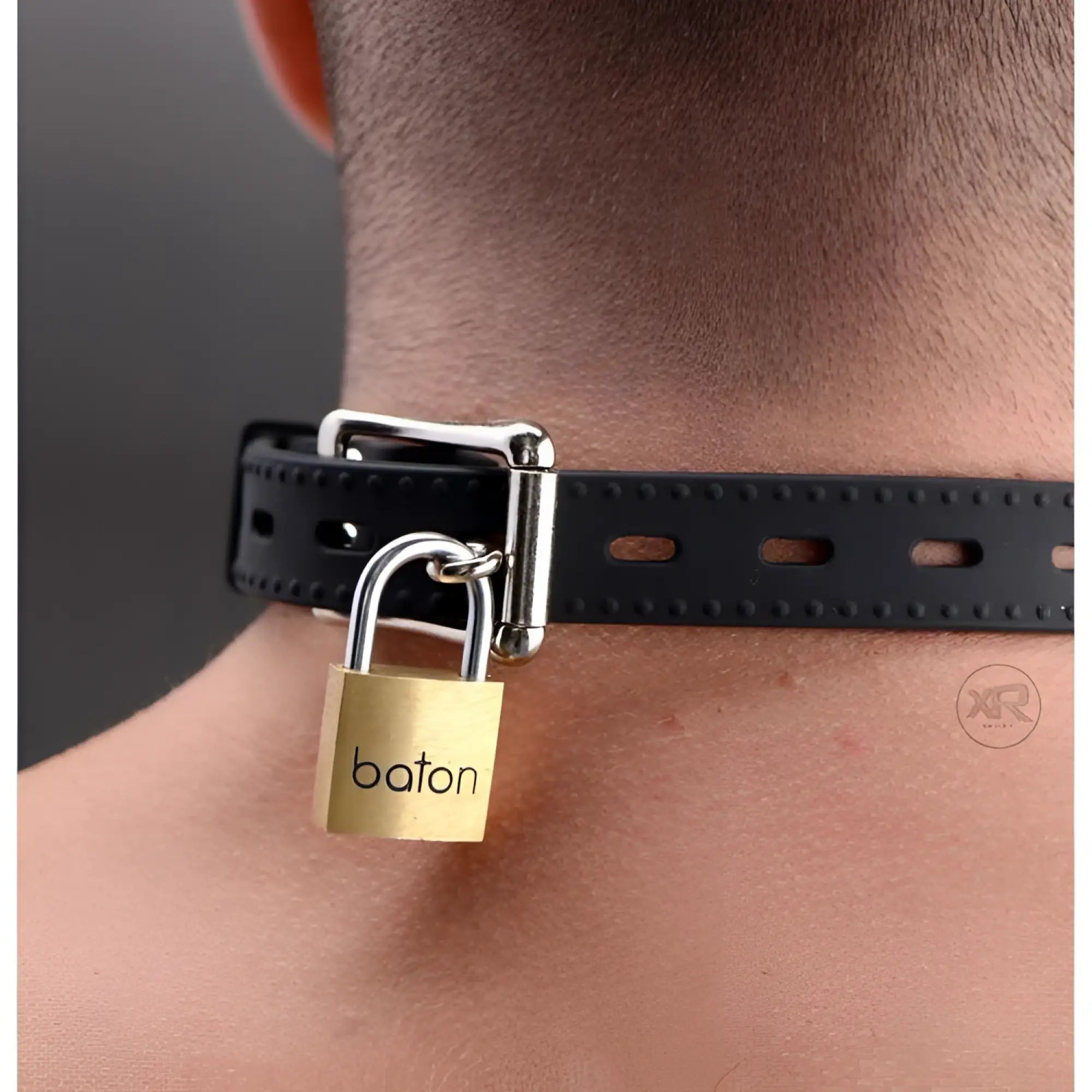 Master Series Hinder black silicone collar secured around a neck with a gold-toned metal padlock.