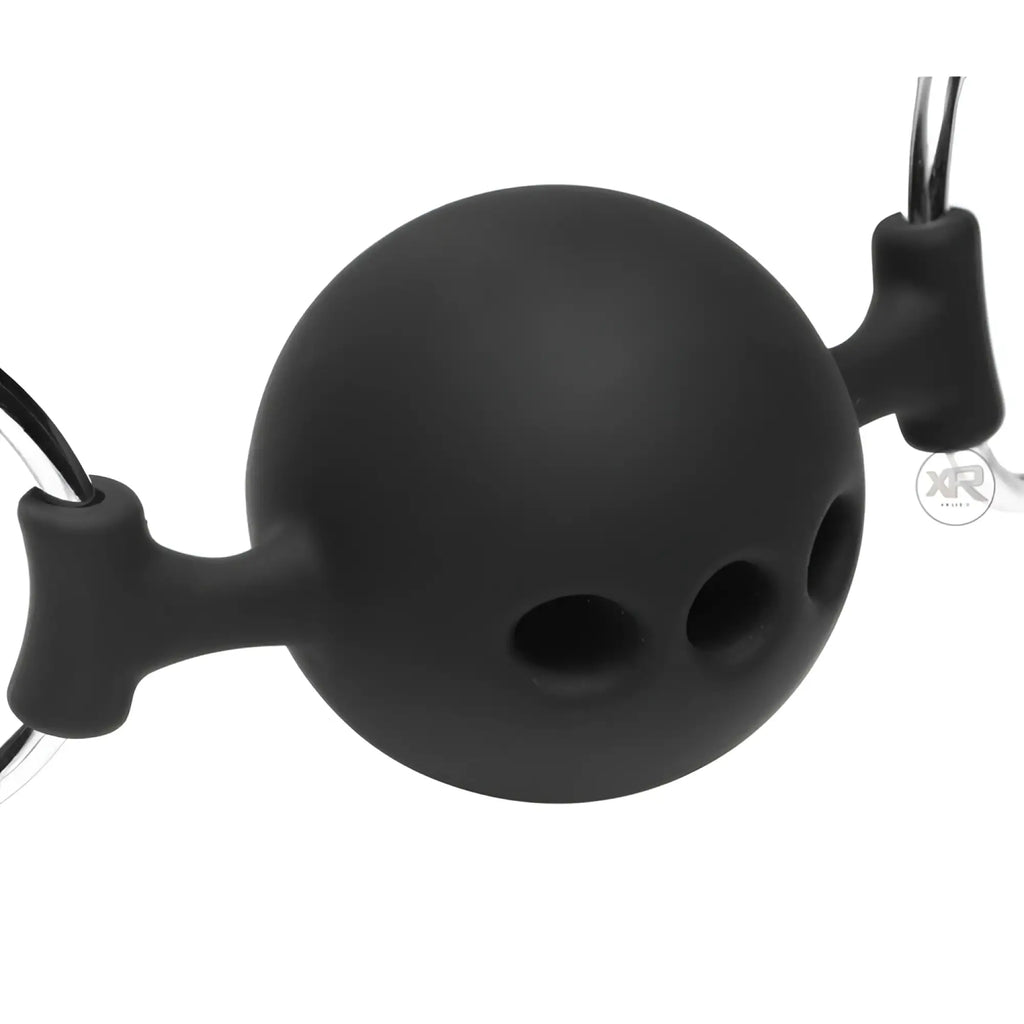 Master Series black silicone ball gag with three breathing holes, metal ring attachments, and integrated nipple clamps.