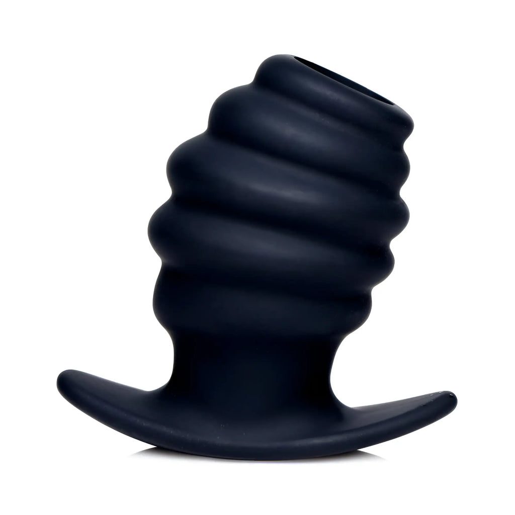 Black silicone Master Series Hive Tunnel anal plug with a ribbed, hollow design and flared base on a white background.