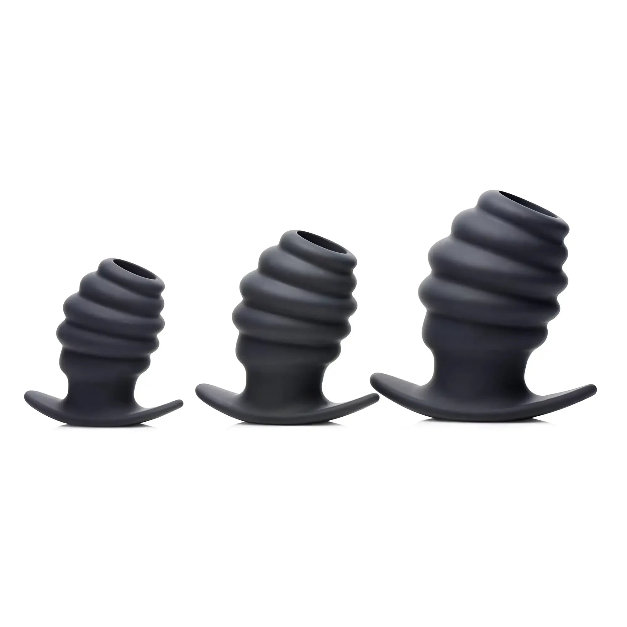 Three dark grey silicone Master Series Hive hollow anal plugs in ascending sizes with ribbed, spiral-textured designs.