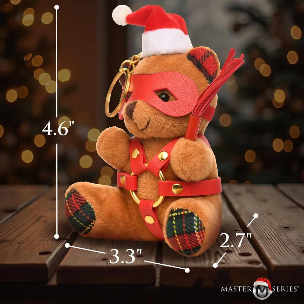 Master Series Holiday Bondage Bear keychain: brown plush bear in a red eye mask, Santa hat, and faux-leather harness.