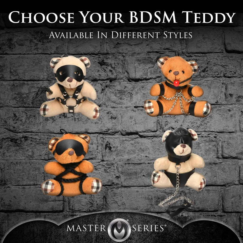 Master Series Hooded Teddy Bear Keychains: Four plush bears in assorted BDSM-themed outfits on a grey brick background.