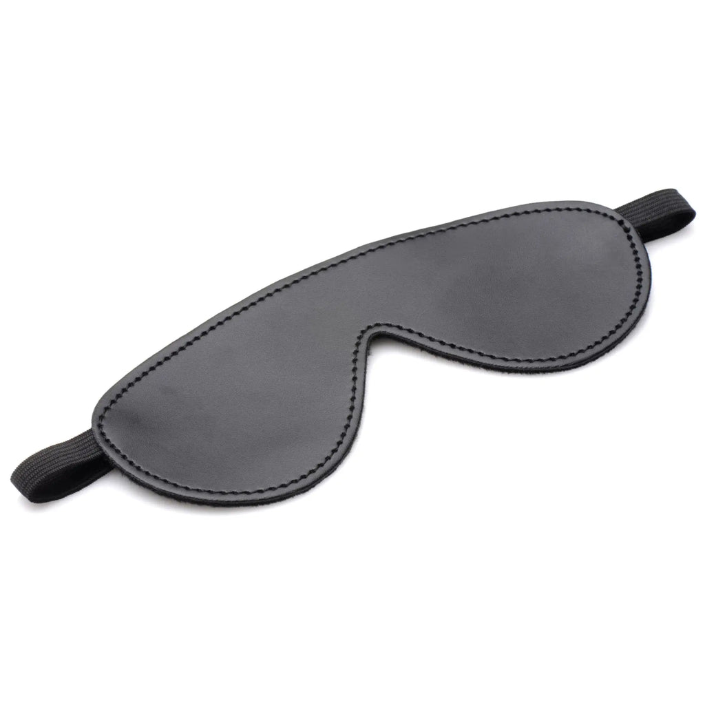 Master Series Hook Up bondage set: black faux-leather blindfold with stitched edges and an elastic head strap.